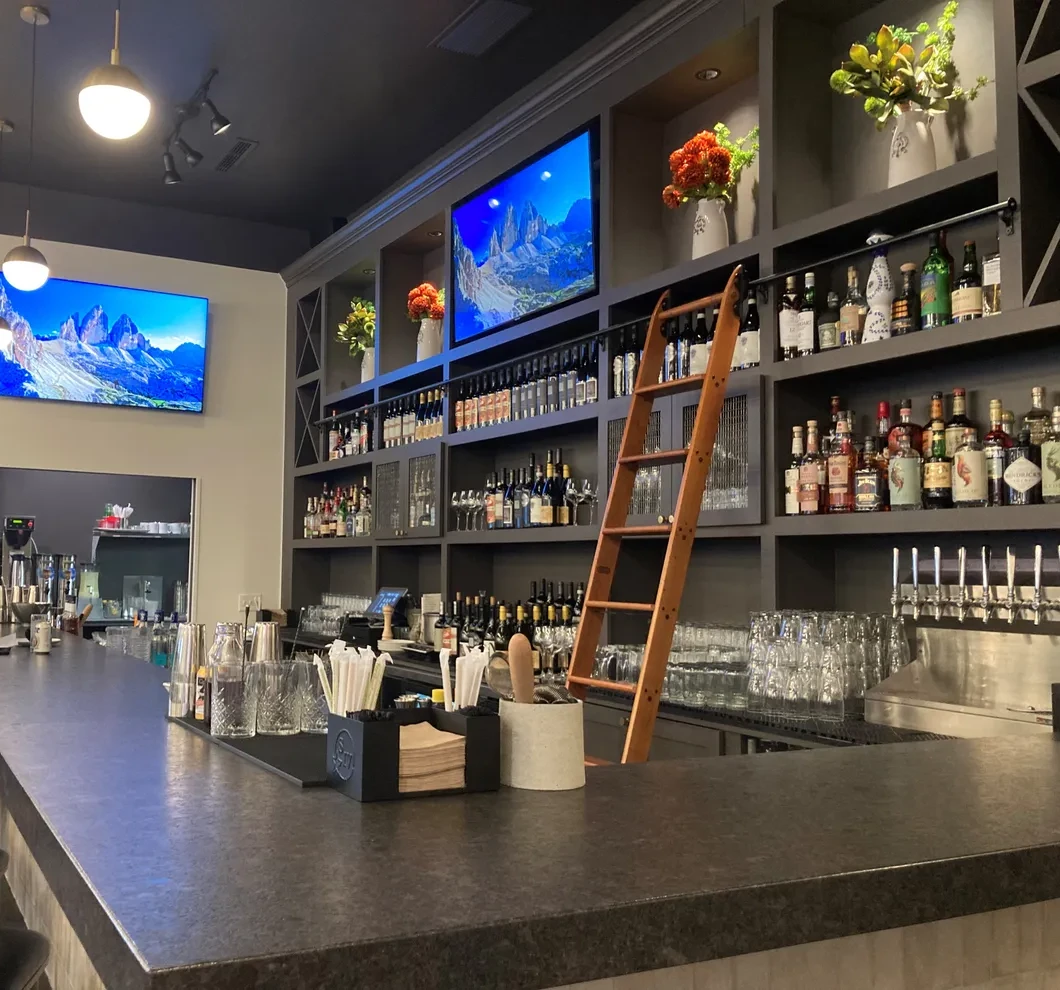 Harvest Granville bar with draft taps and backlit spirits shelves